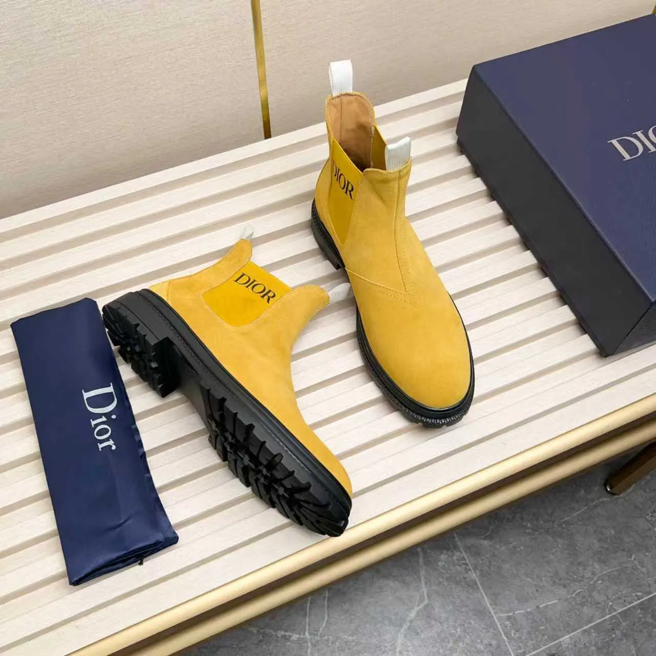 Men's Shoes 💰480 Dior A practical choice that combines protection with classic style. Made from durable Rugged Calf leather, it's tumbled and hand-finished to create a soft suede feel with a rich texture. Elastic side panels and subtle cutouts are inspired by the classic Chelsea boot. Leather upper and lining with Kummel tabs at front and rear, rubber outsole